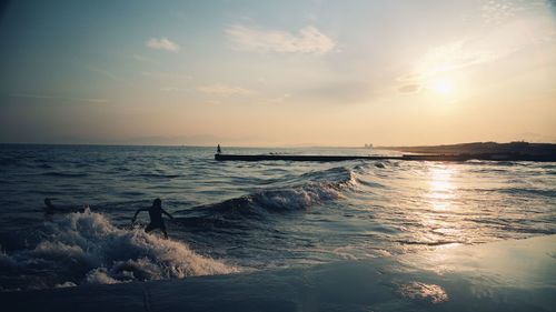 Scenic view of sea against sky during sunset