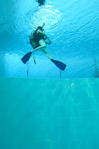 Man swimming in pool