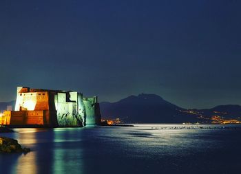 View of illuminated buildings at waterfront