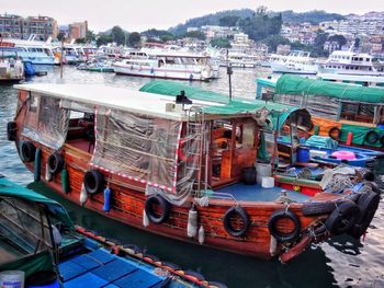 High angle view of boats moored at harbor in city