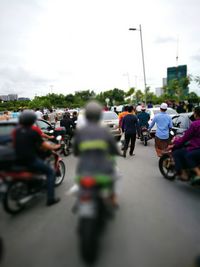 People riding bicycle on road