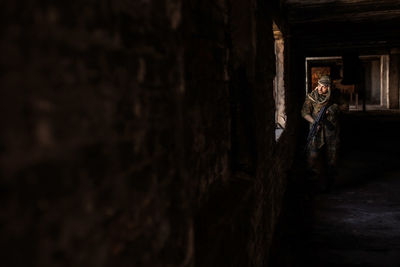 Portrait of serious middle eastern man with ak-47