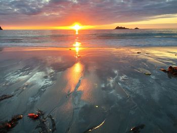 Scenic view of sea at sunset