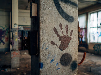 Close-up of graffiti on old wall