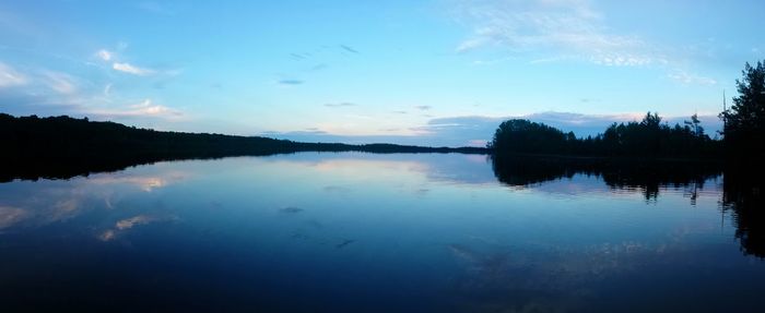 Reflection of trees in calm lake