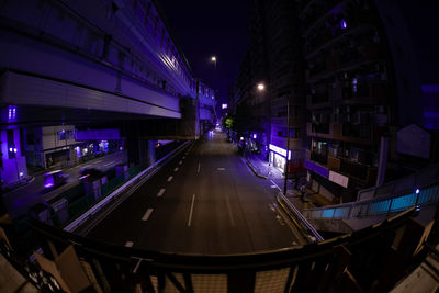 Low angle view of modern buildings in city at night