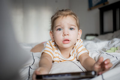 Close-up of cute baby girl at home