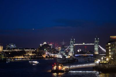 Illuminated city at waterfront