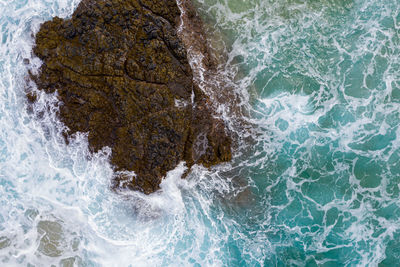 Sea waves splashing on rocks