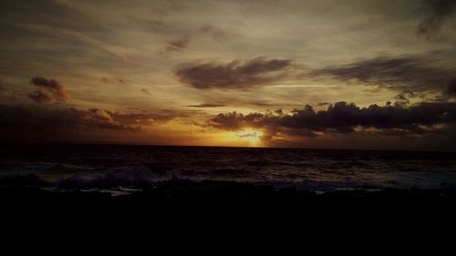 Scenic view of sea at sunset