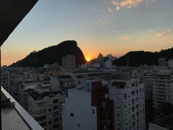 Cityscape against sky during sunset