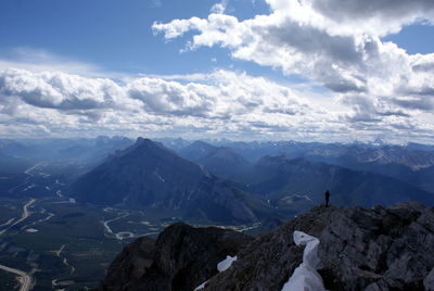 Scenic view of mountains against cloudy sky