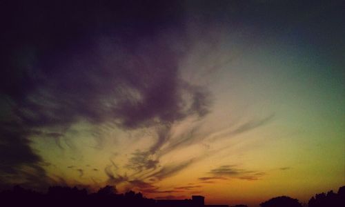 Silhouette of tree against dramatic sky