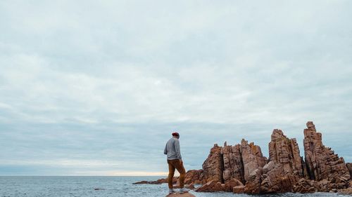 Scenic view of sea against cloudy sky