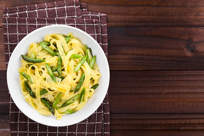 High angle view of chopped vegetables in bowl on table