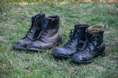 Close-up of shoes on field