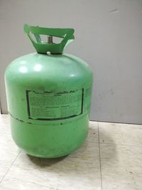 Close-up of green container on table