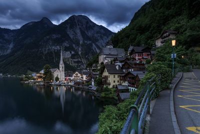 Town by mountains against sky