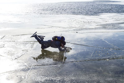 High angle view of man in sea during winter