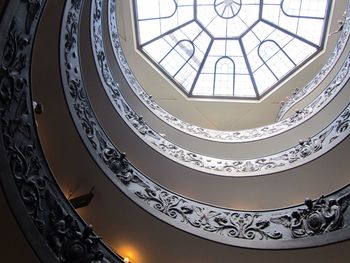 Low angle view of patterned railings and skylight