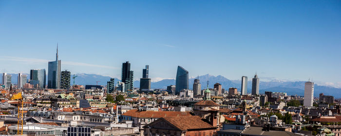 Cityscape against blue sky