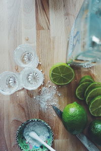 Preparation of lemonade on wooden table