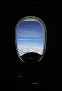 View of clouds seen through airplane window