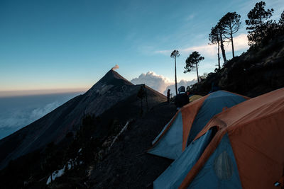 Scenic view of rocky mountains against blue sky