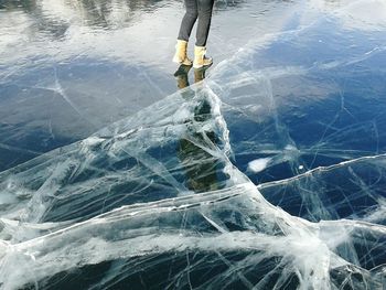 Low section of man wearing shoes