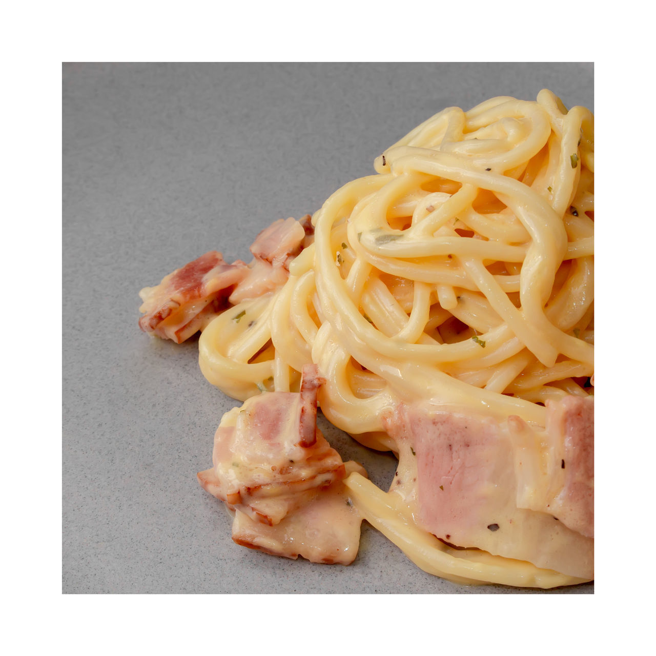 HIGH ANGLE VIEW OF PASTA WITH MEAT AND FORK