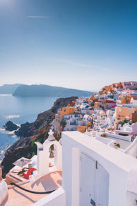 High angle view of townscape by sea against sky