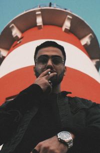 Low angle view of man smoking