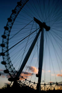 Low angle view of ferris wheel against sky