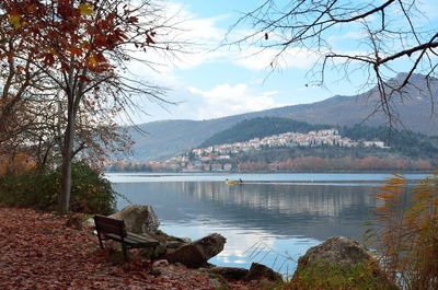 Bench with view reflections on the lake and districts of town kastoria in greece