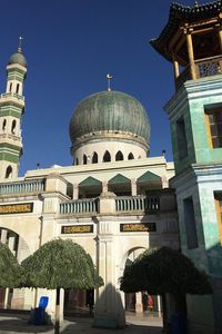 Low angle view of mosque against clear sky