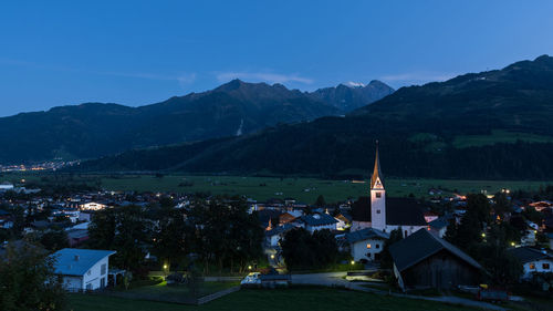 Townscape by building against sky at night