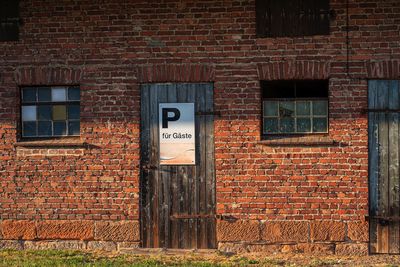 Text on brick wall of building