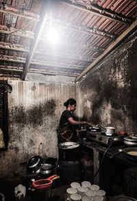 Portrait of man sitting in kitchen