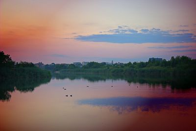 Scenic view of lake against sky during sunset