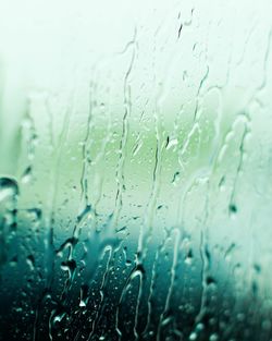 Close-up of raindrops on glass window