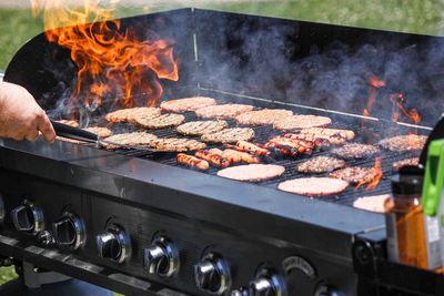 Man preparing food on barbecue grill