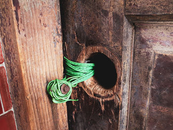 Rope tied on old wooden door