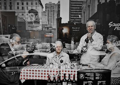 Portrait of people standing in city