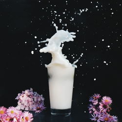 Close-up of water splashing against black background
