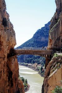 View of bridge over mountain against sky