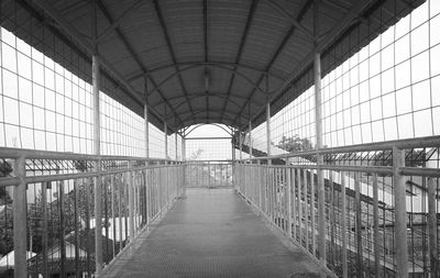 Empty elevated walkway at railroad station