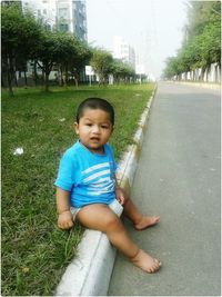 Portrait of boy on grass