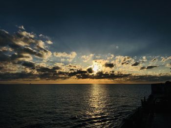 Scenic view of sea against sky at sunset