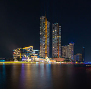 Illuminated buildings in city at night