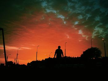 Silhouette of people at sunset